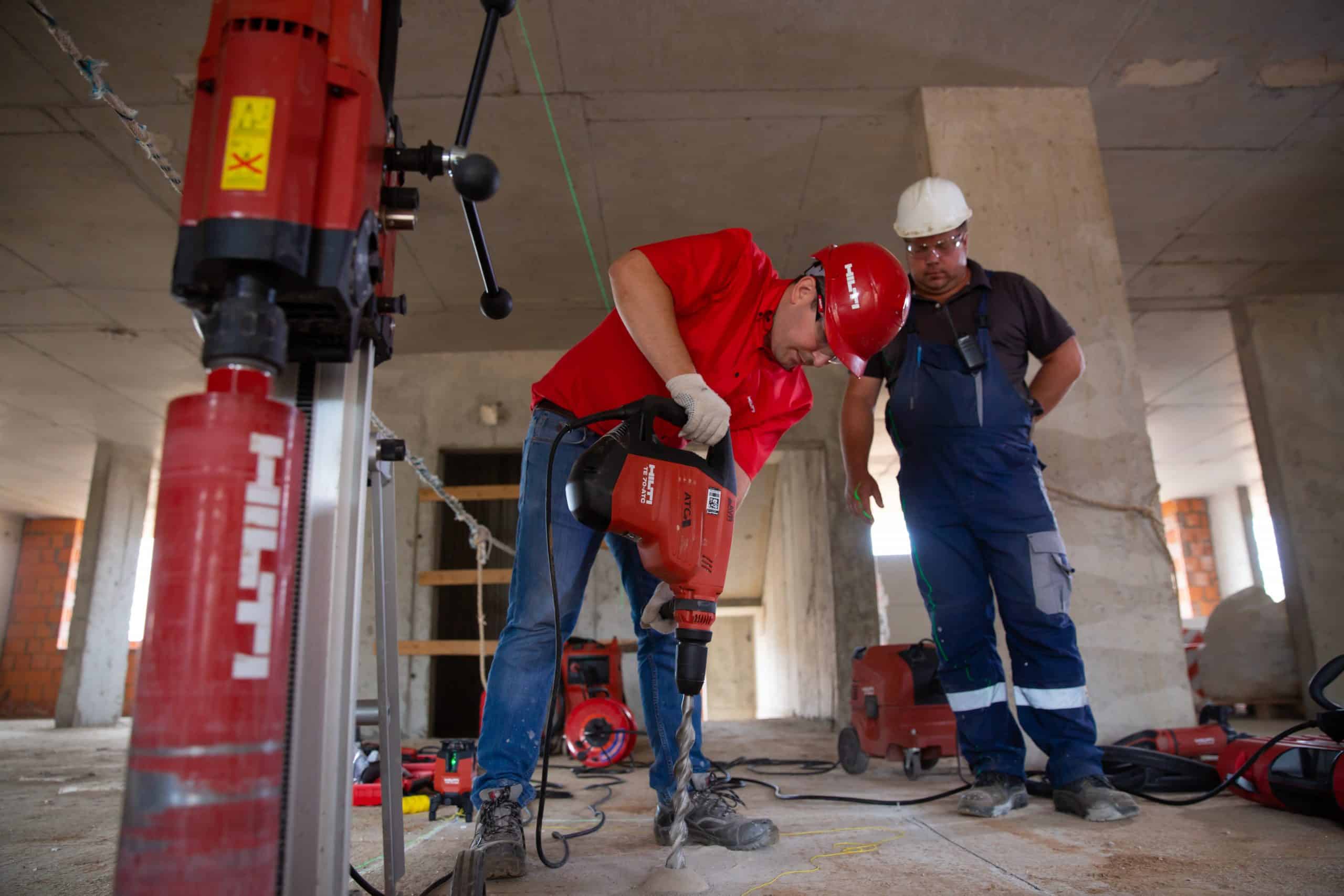 Man drilling into concrete