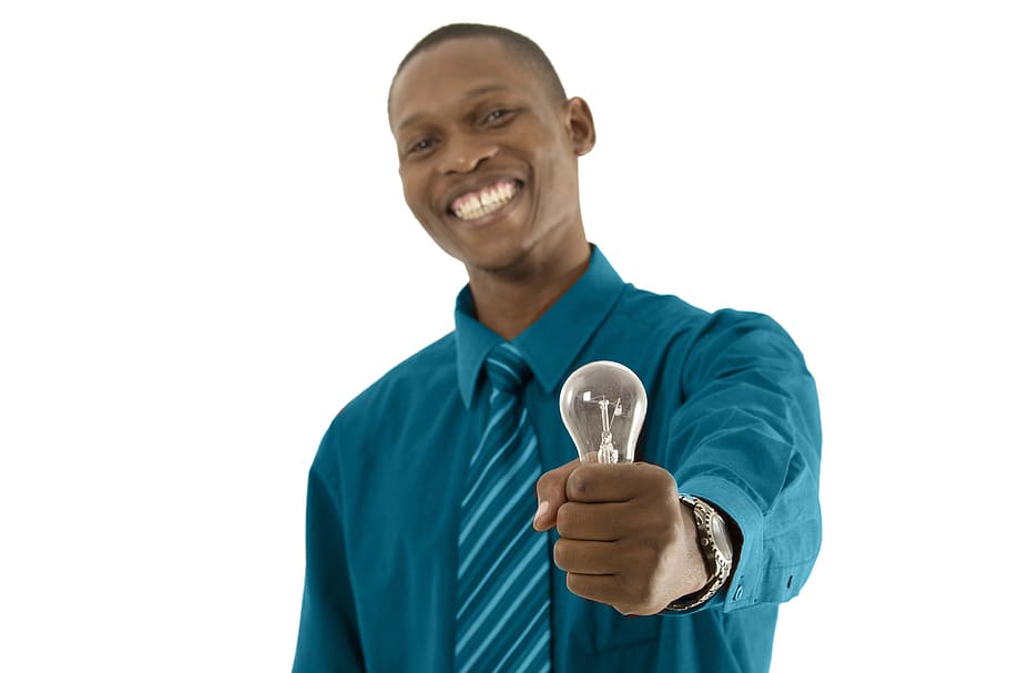 A guy holding a light to conclude the idea
